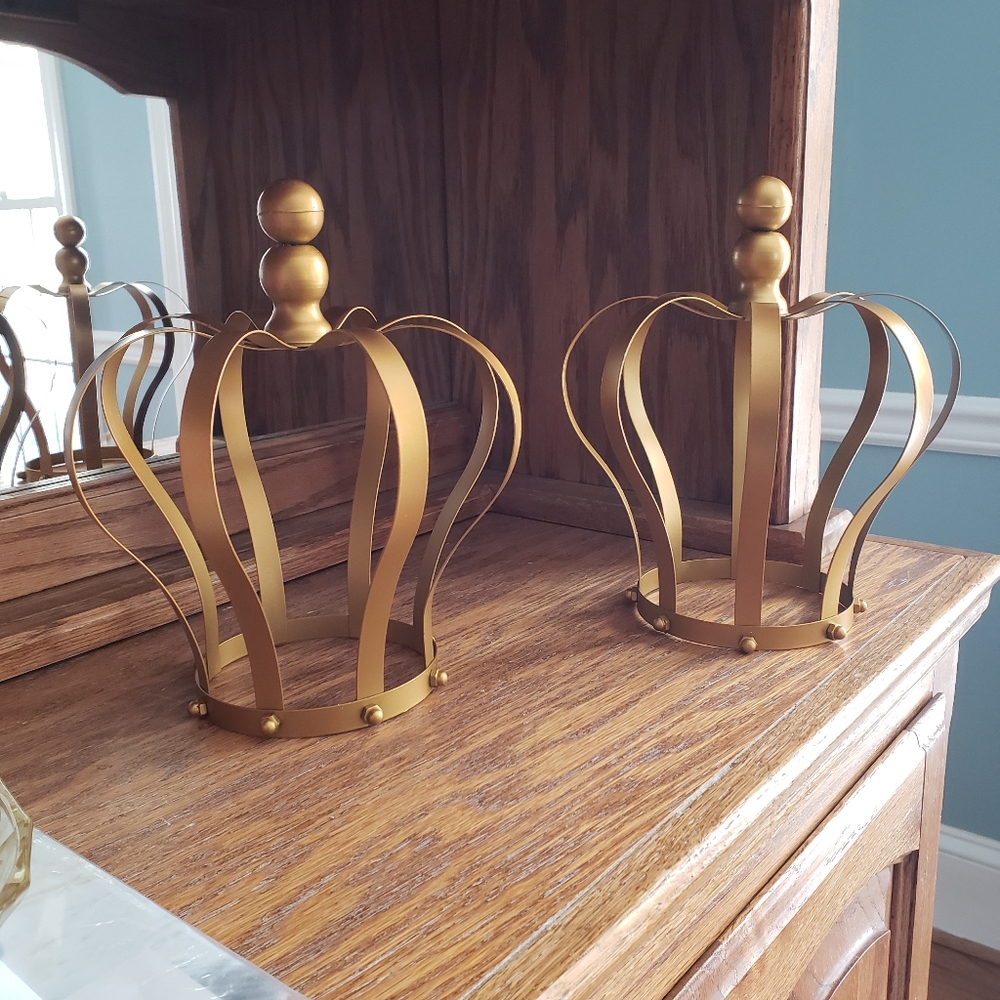 Two gold color crowns.